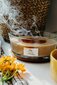 WoodWick kvapioji žvakė Golden Milk, 453,6 g kaina ir informacija | Žvakės, Žvakidės | pigu.lt