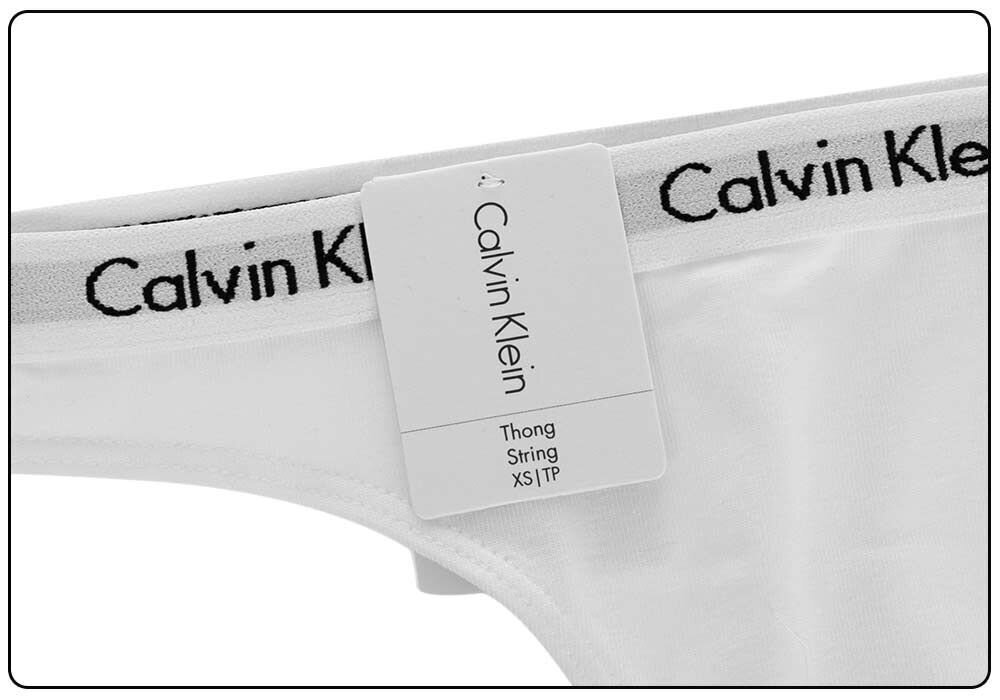 Moteriškos kelnaitės Calvin Klein THONG WHITE D1617E 100 30236 kaina ir informacija | Kelnaitės | pigu.lt