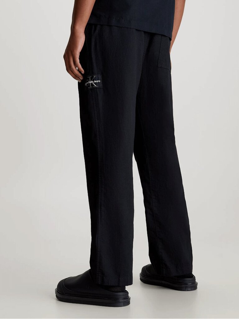 Kelnės vyrams Calvin Klein Jeans, juodos kaina ir informacija | Vyriškos kelnės | pigu.lt
